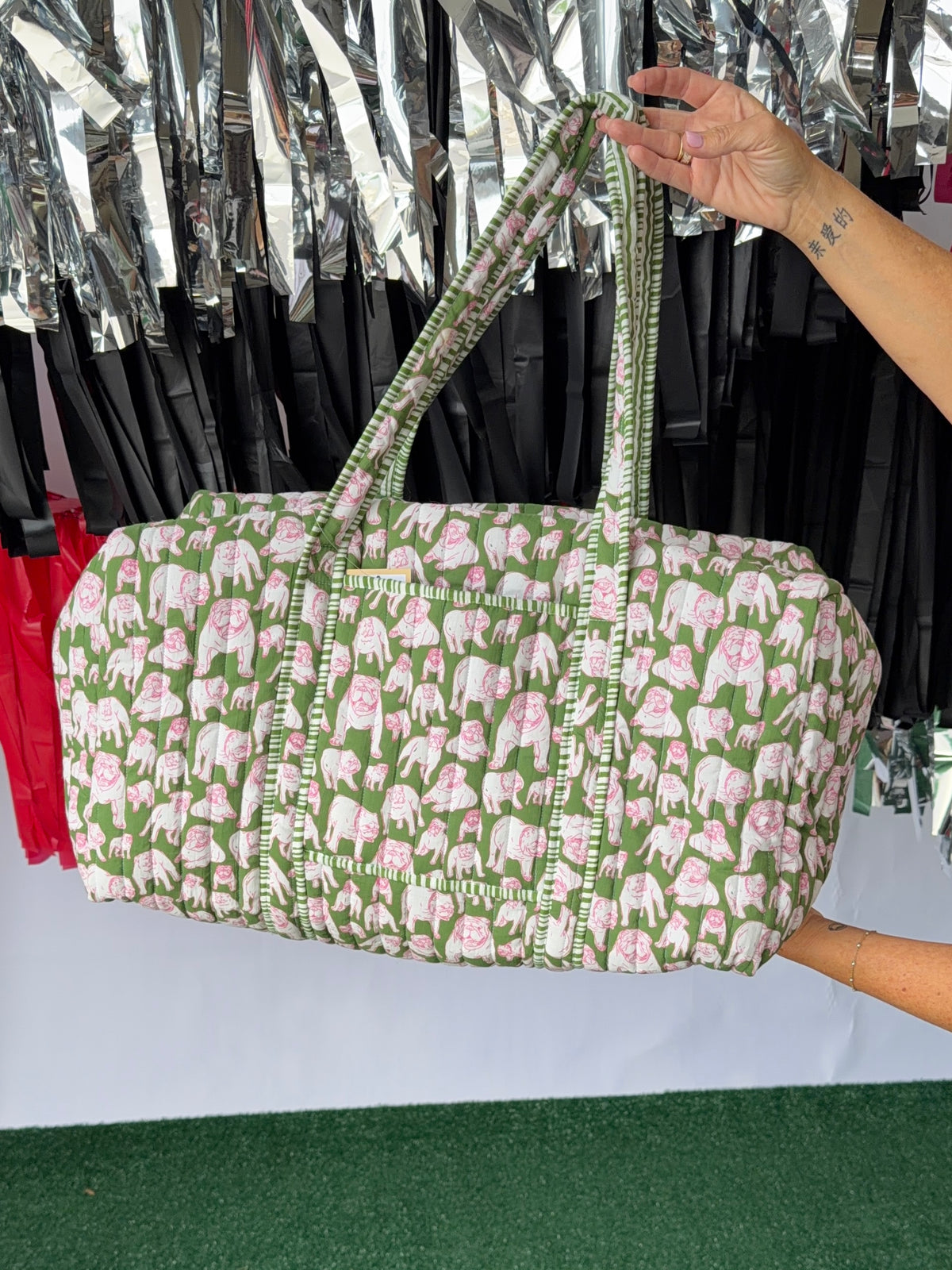 Green and pink quilted bulldog duffle