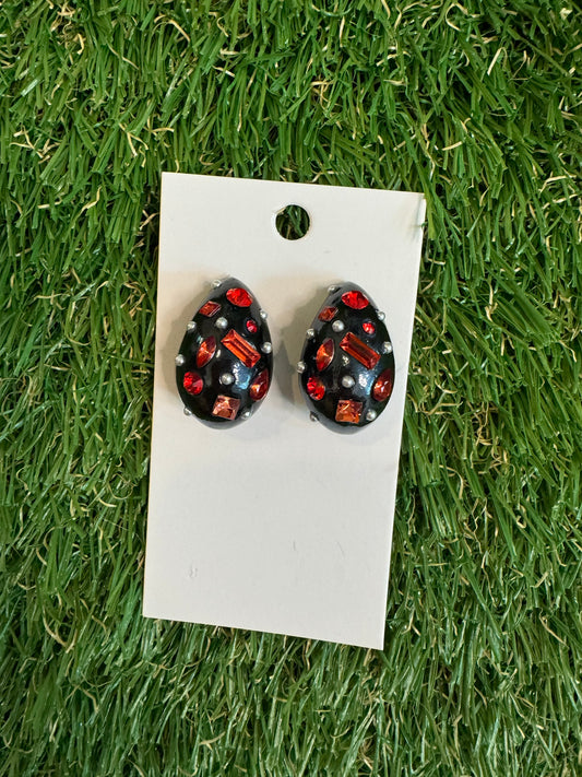 Black resin tear drop earrings with red stones