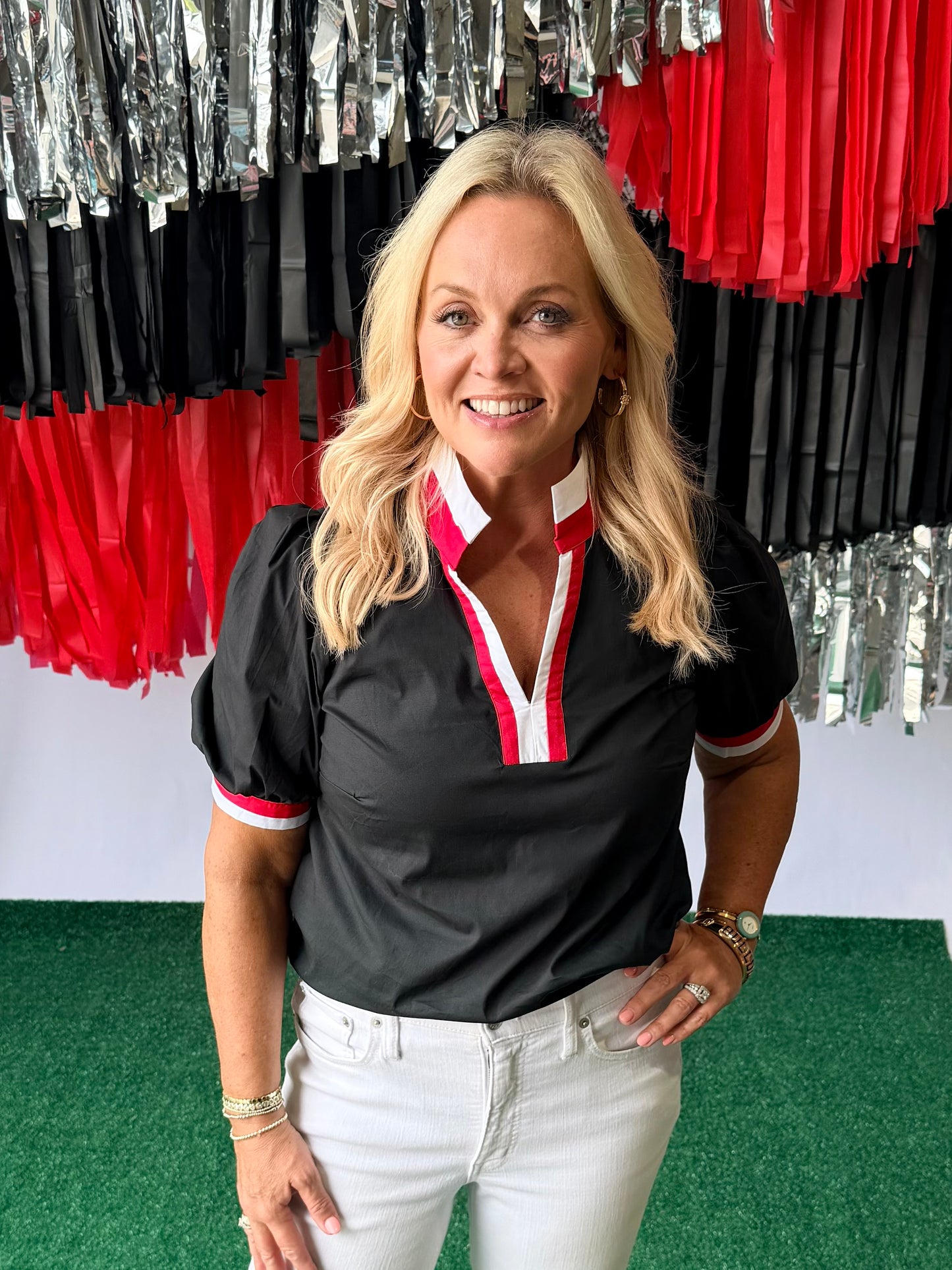 Black blouse with red and white trim