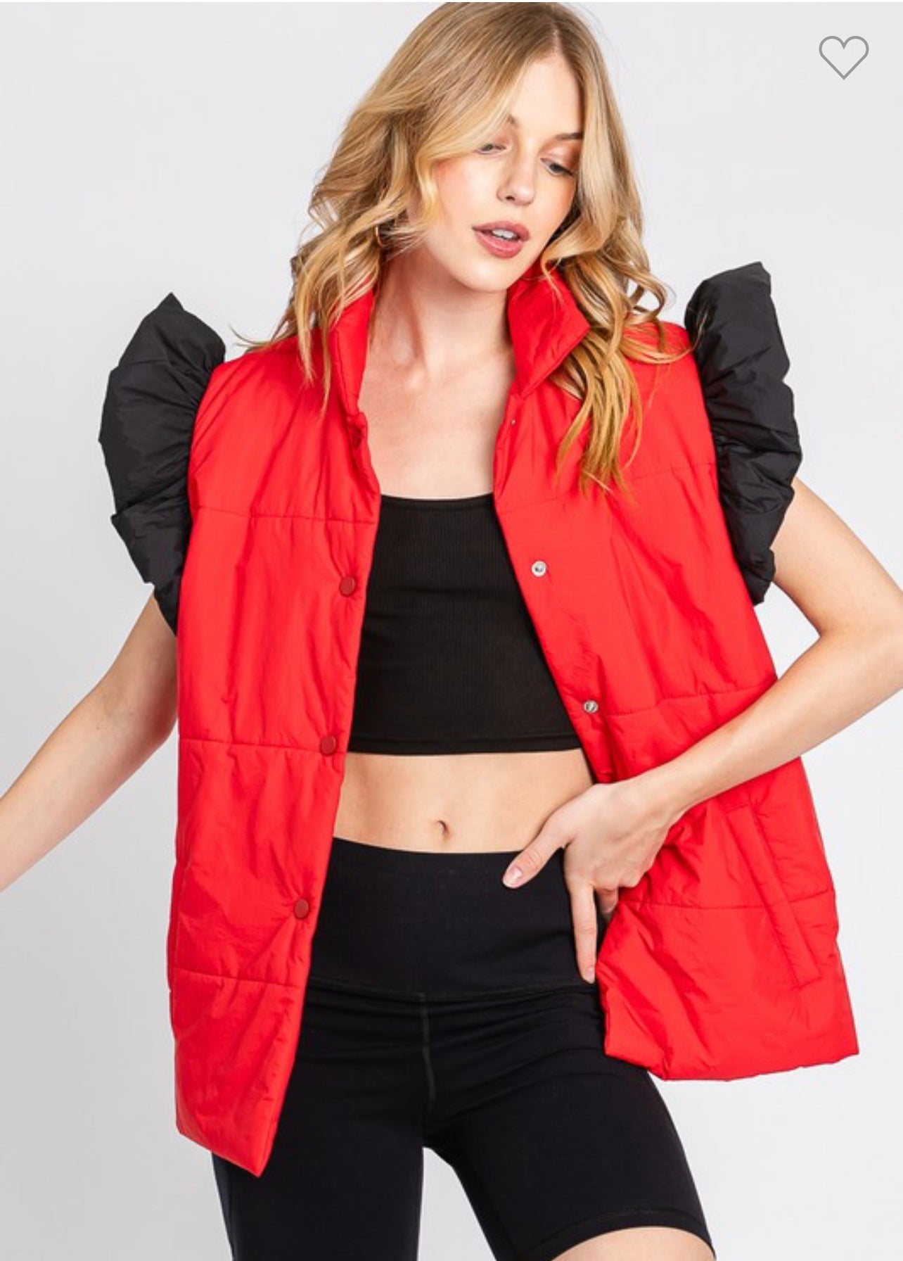 red puffer vest with black ruffle sleeves