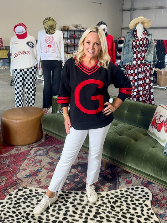 Black pullover with Giant red fuzzy G