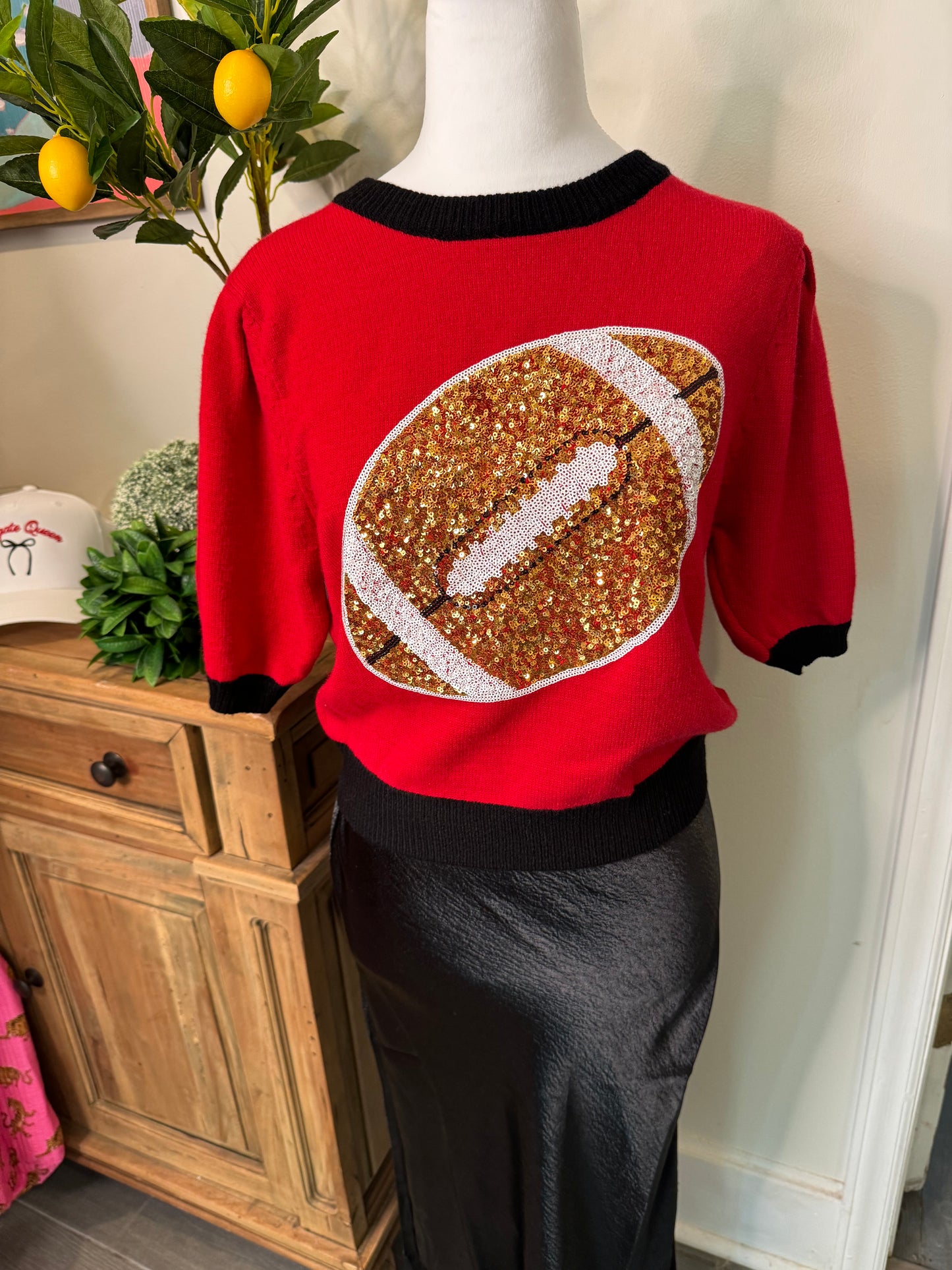 Red and black sweater sequin football