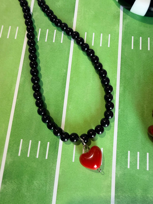 Black beaded necklace with red heart