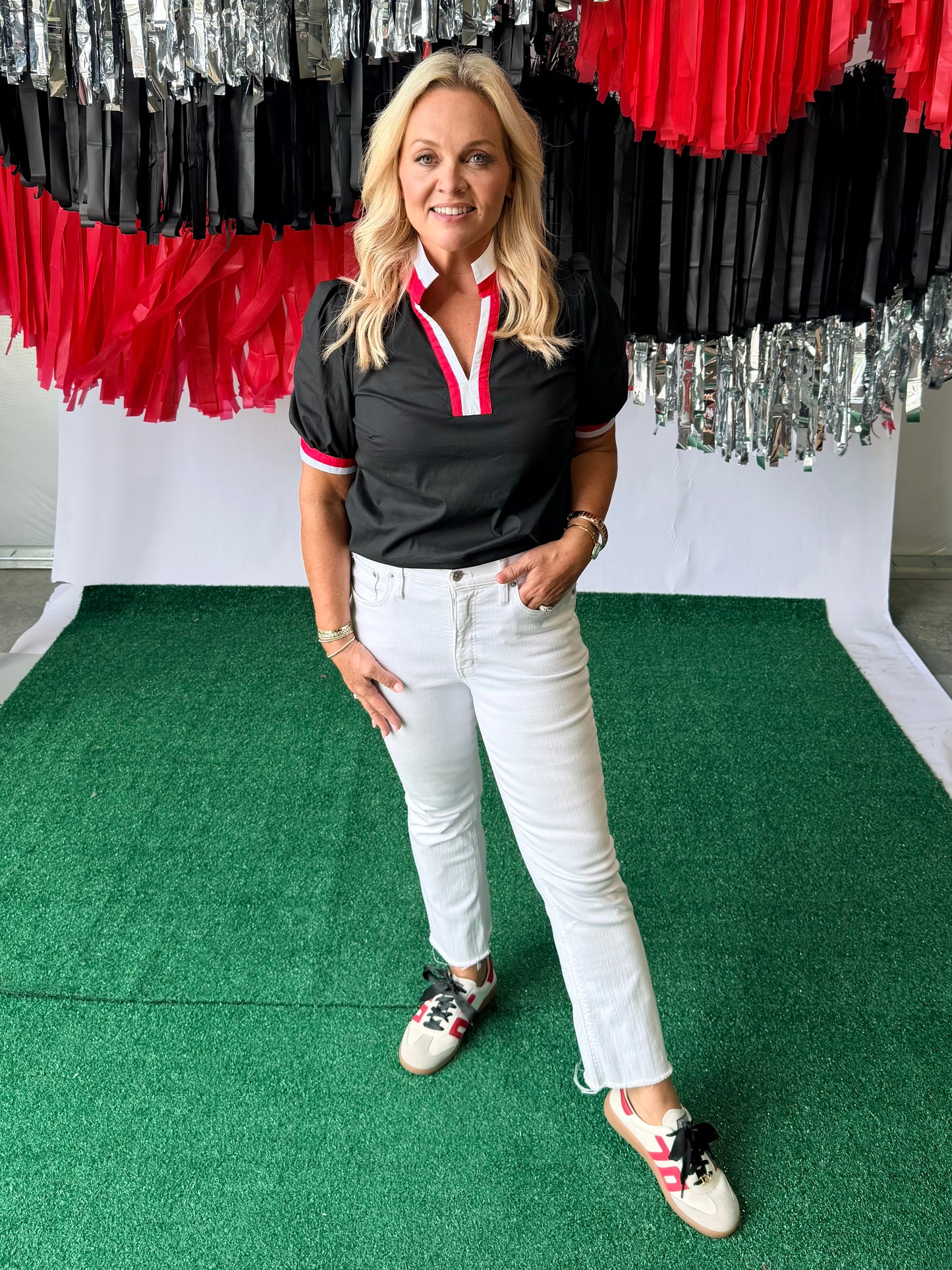 Black blouse with red and white trim