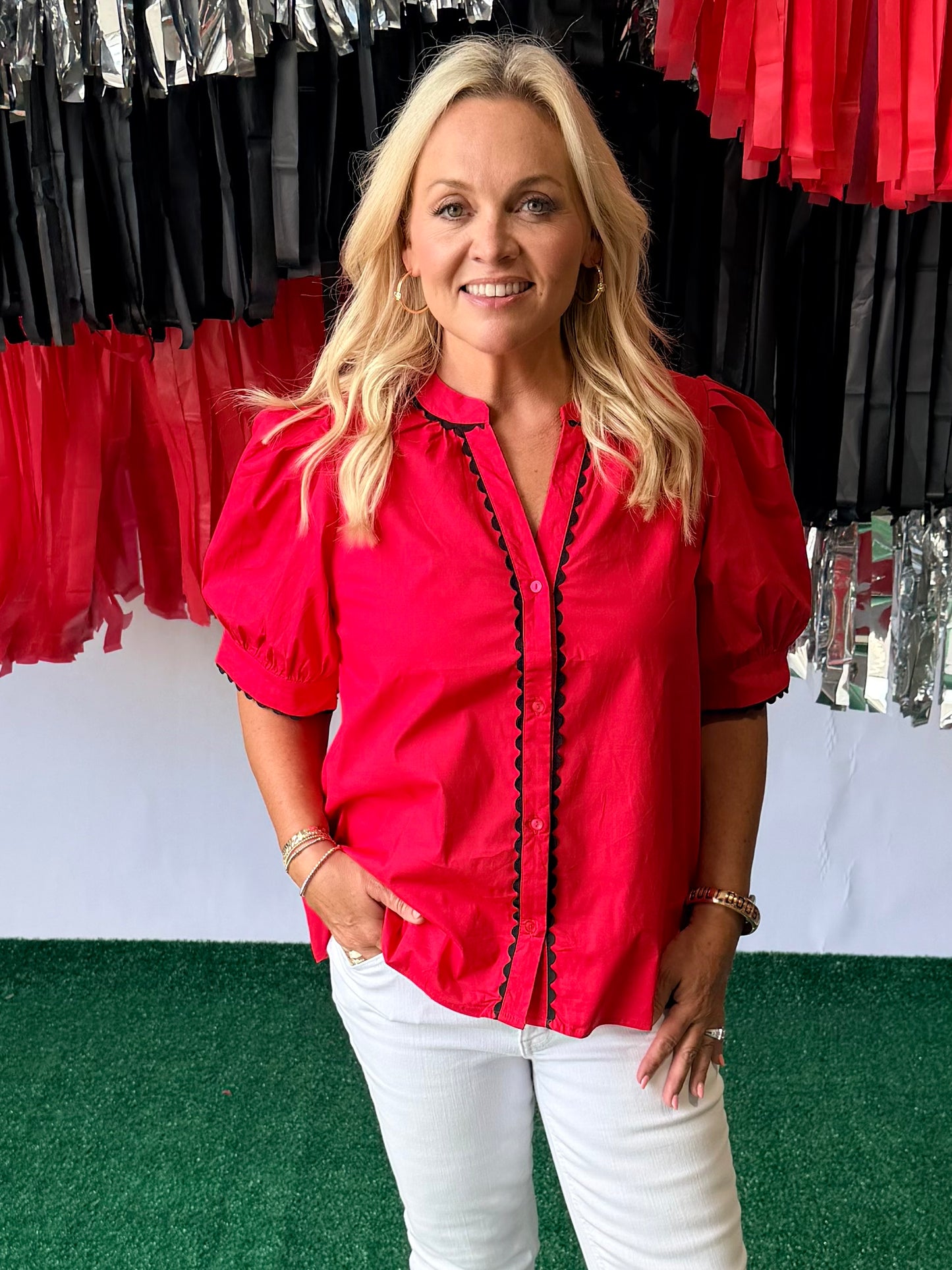 Red blouse with black pipping