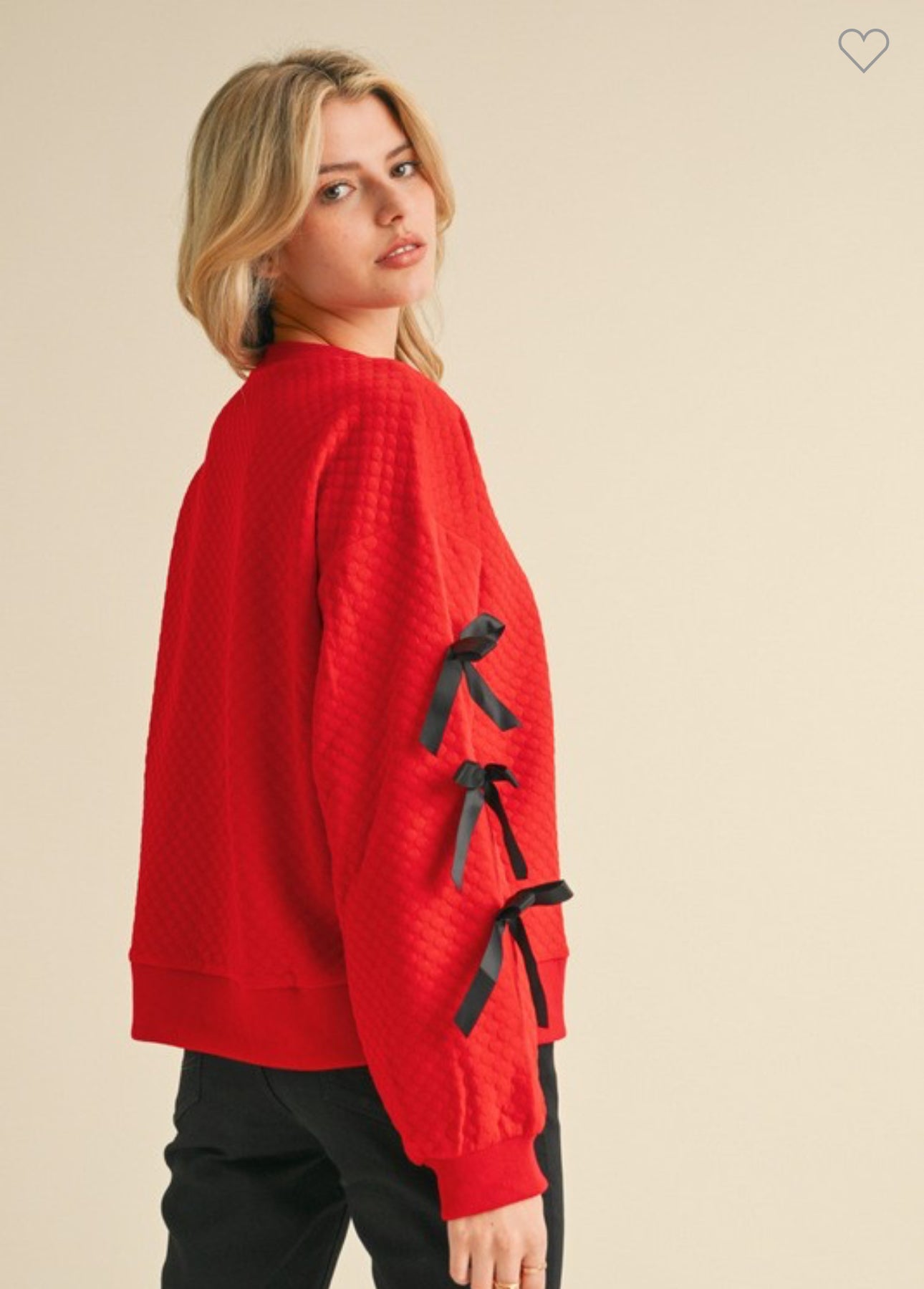 Embossed textured red top with black bows