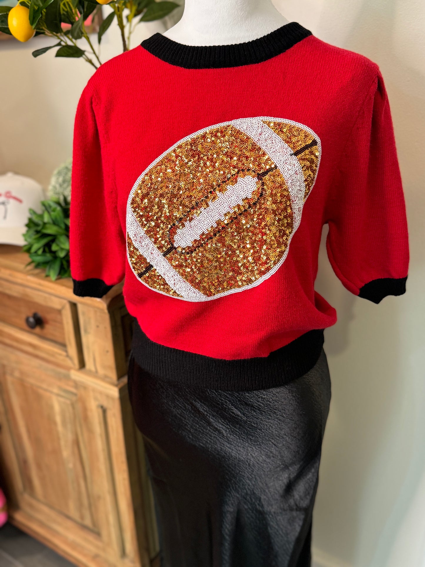 Red and black sweater sequin football