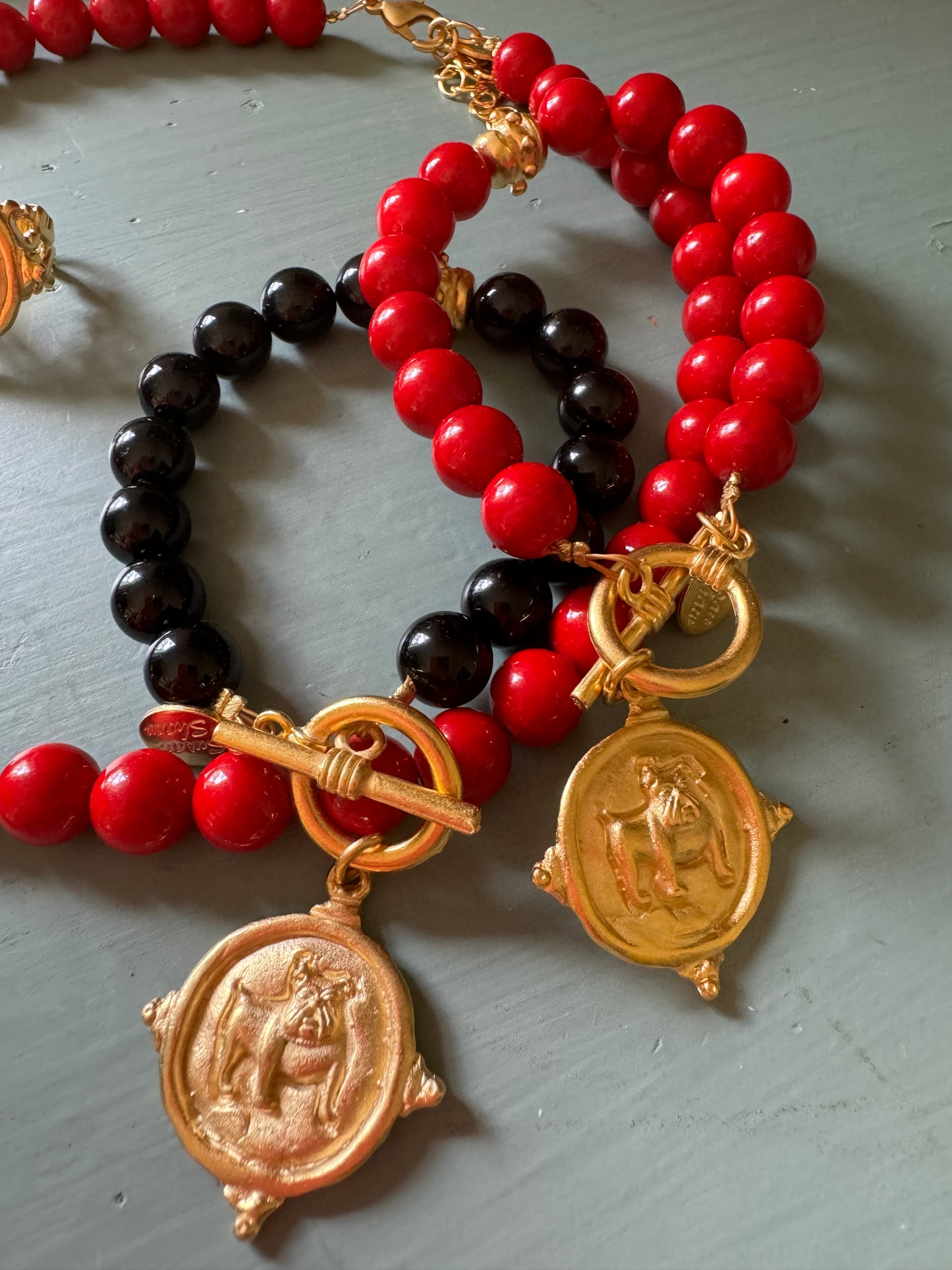 Gold dog medallion bracelet red coral Susan Shaw