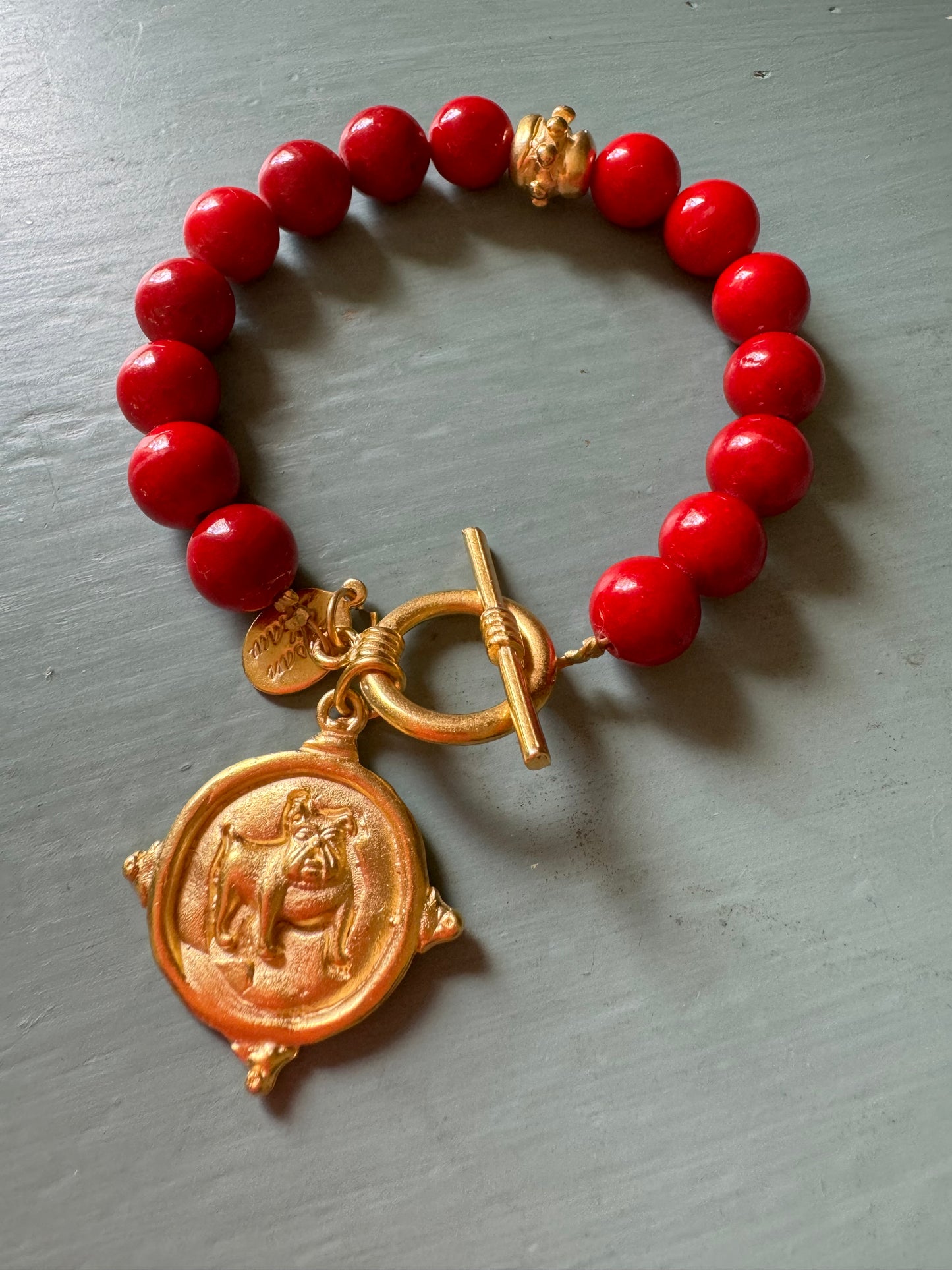 Gold dog medallion bracelet red coral Susan Shaw