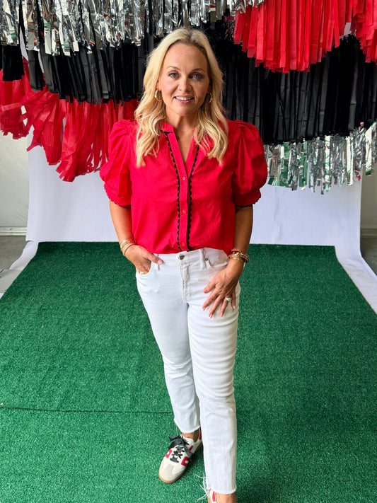 Red blouse with black pipping