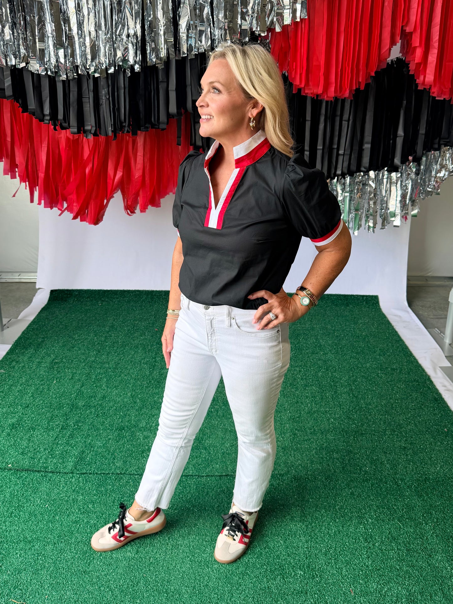 Black blouse with red and white trim
