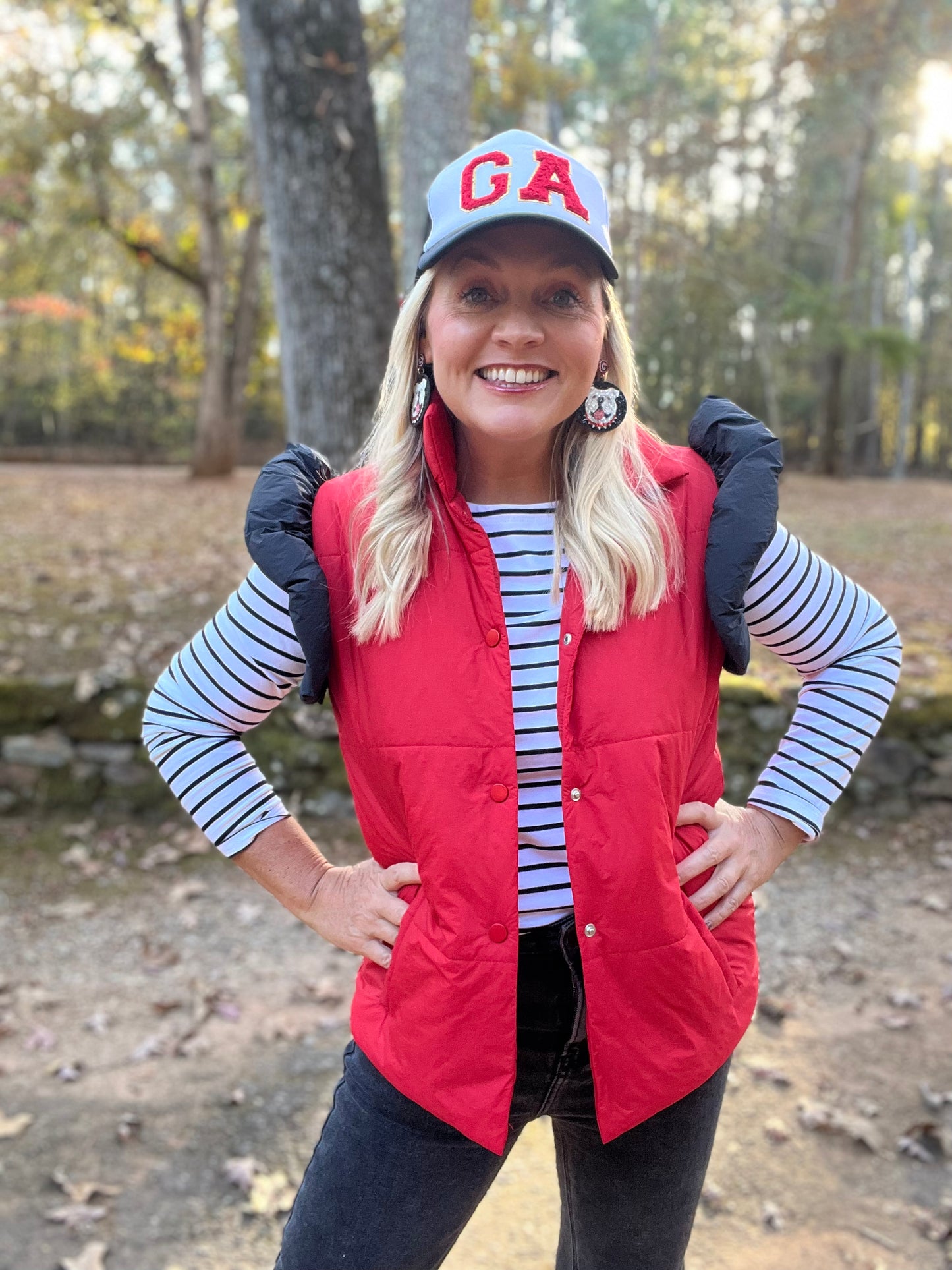 red puffer vest with black ruffle sleeves