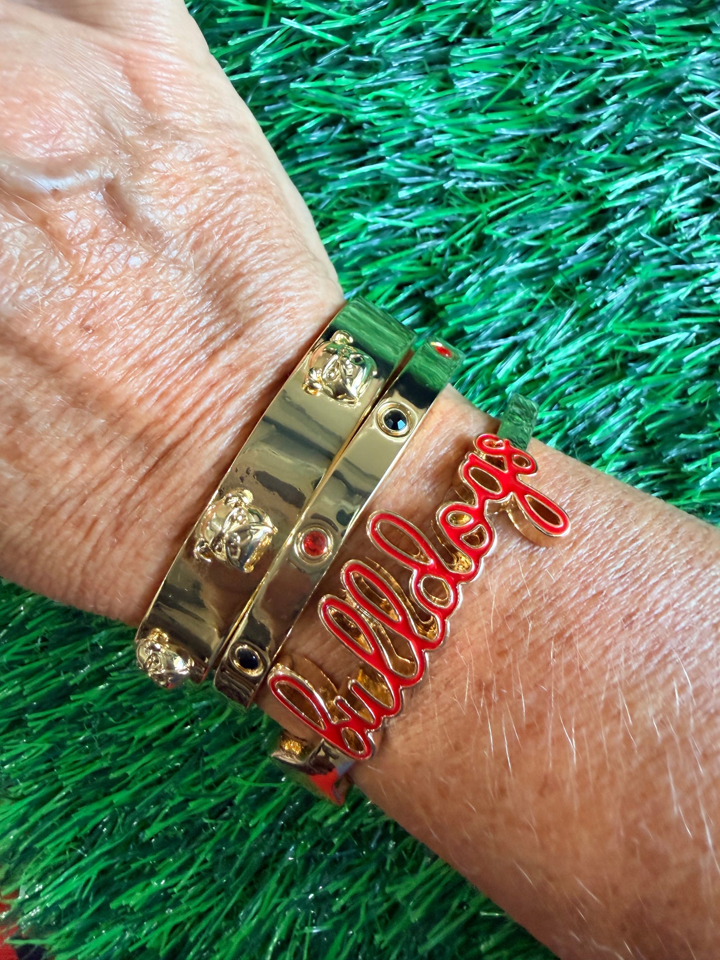 Gold bangle with black and red
