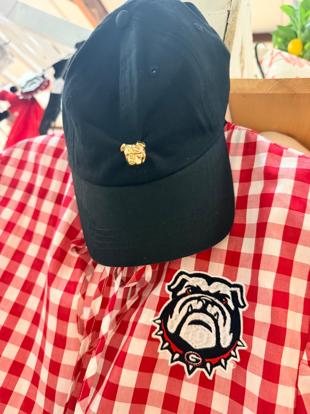 Black hat with gold bulldog