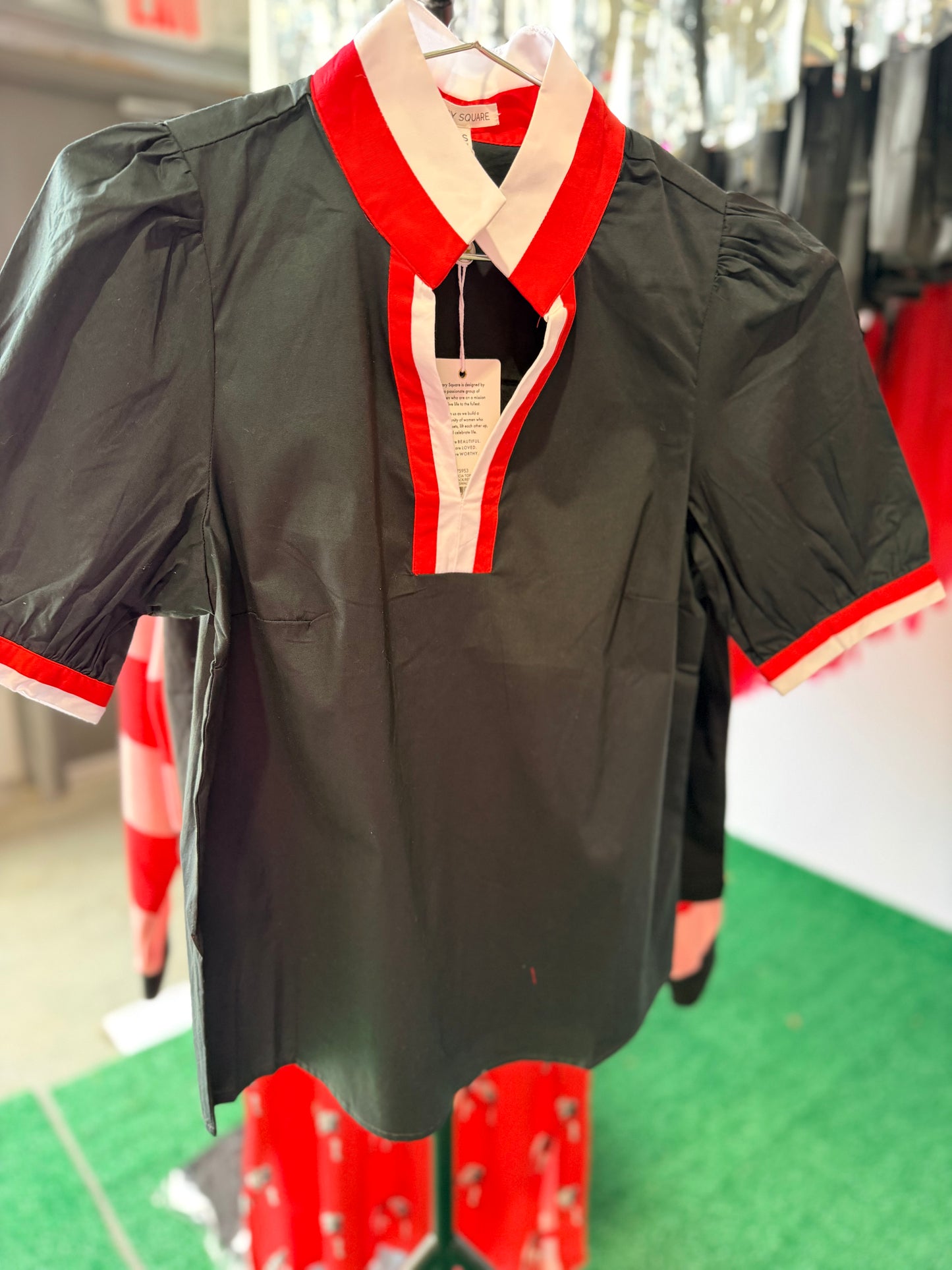 Black blouse with red and white trim
