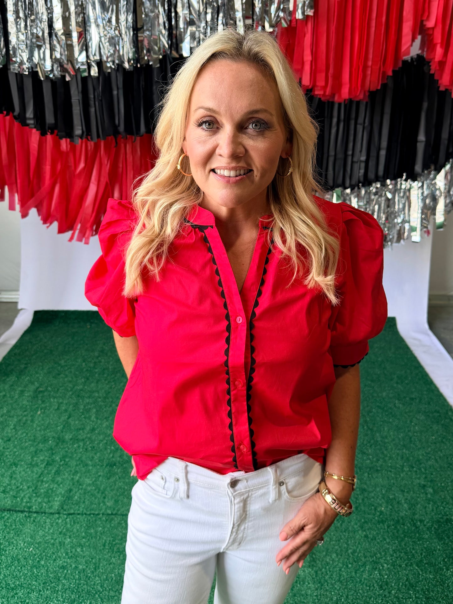 Red blouse with black pipping
