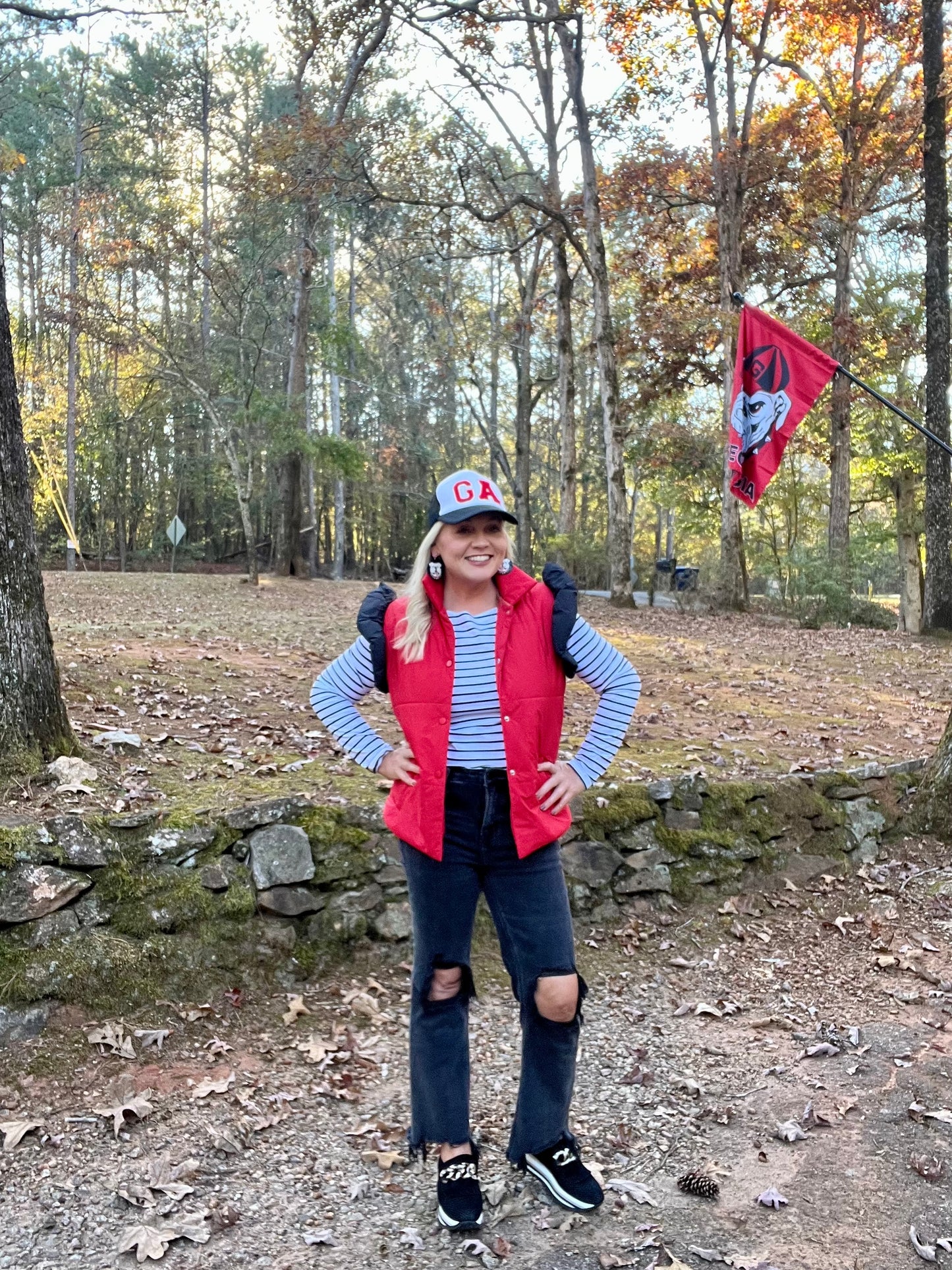 red puffer vest with black ruffle sleeves