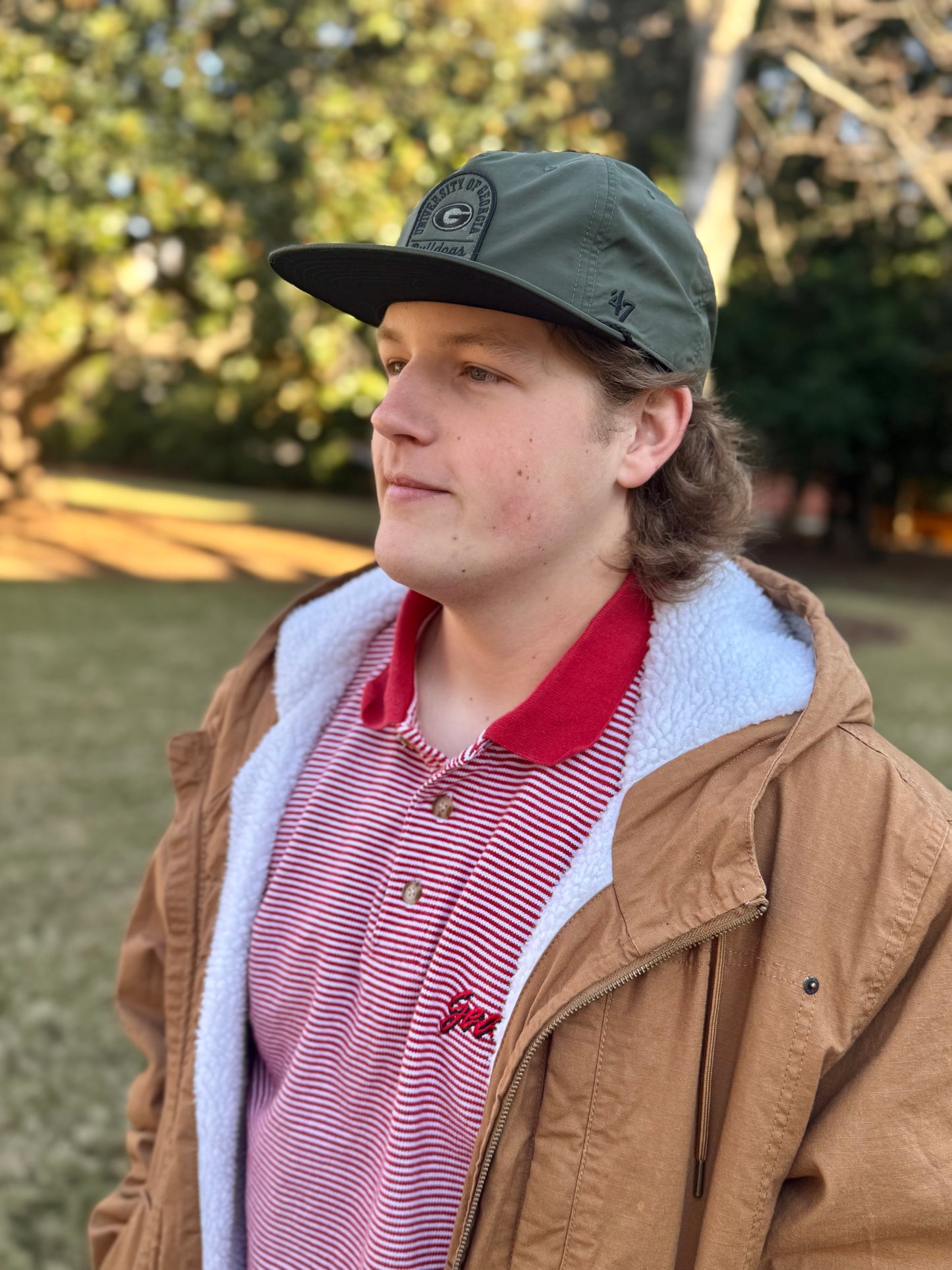 Olive green pier captain flat brim hat