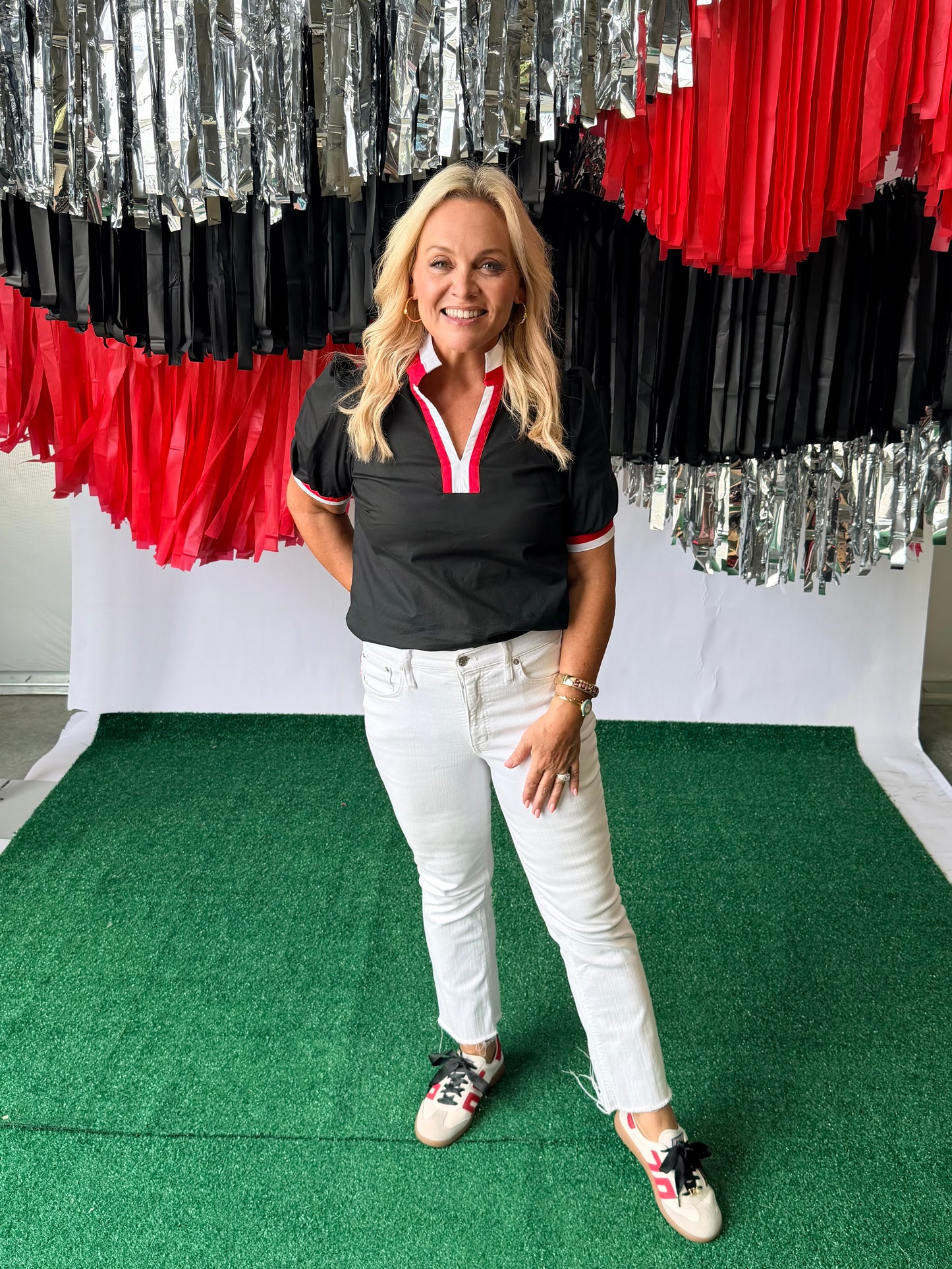 Black blouse with red and white trim