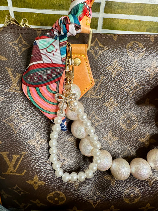 Pearl purse charm with bow
