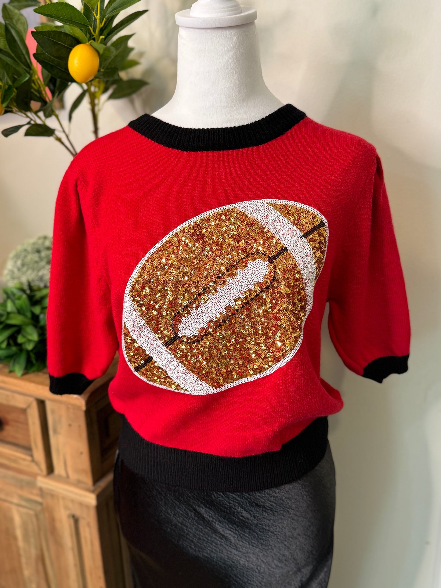 Red and black sweater sequin football