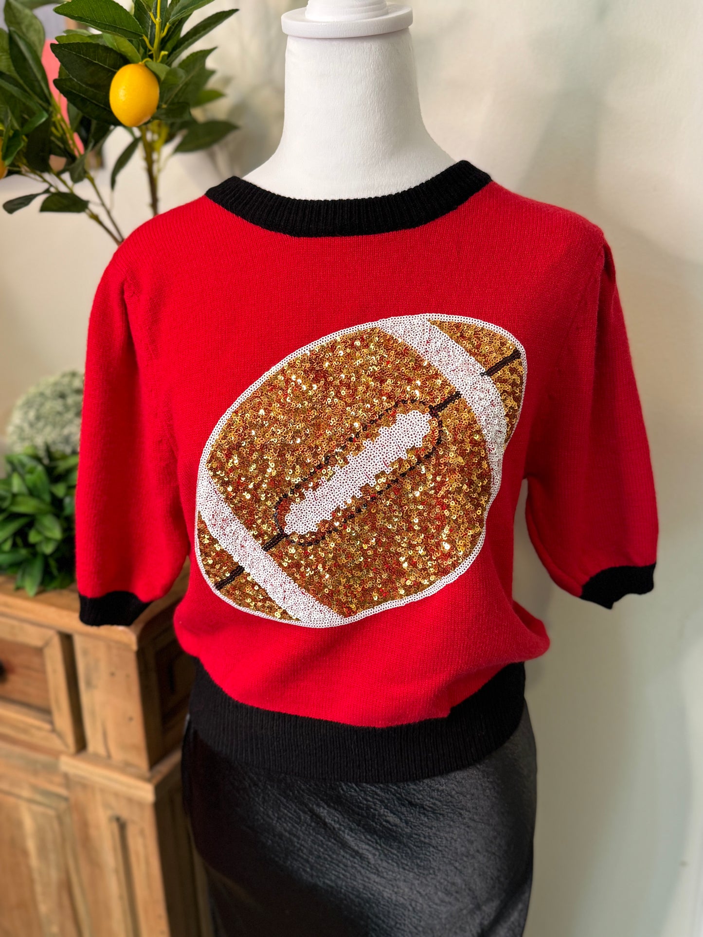 Red and black sweater sequin football