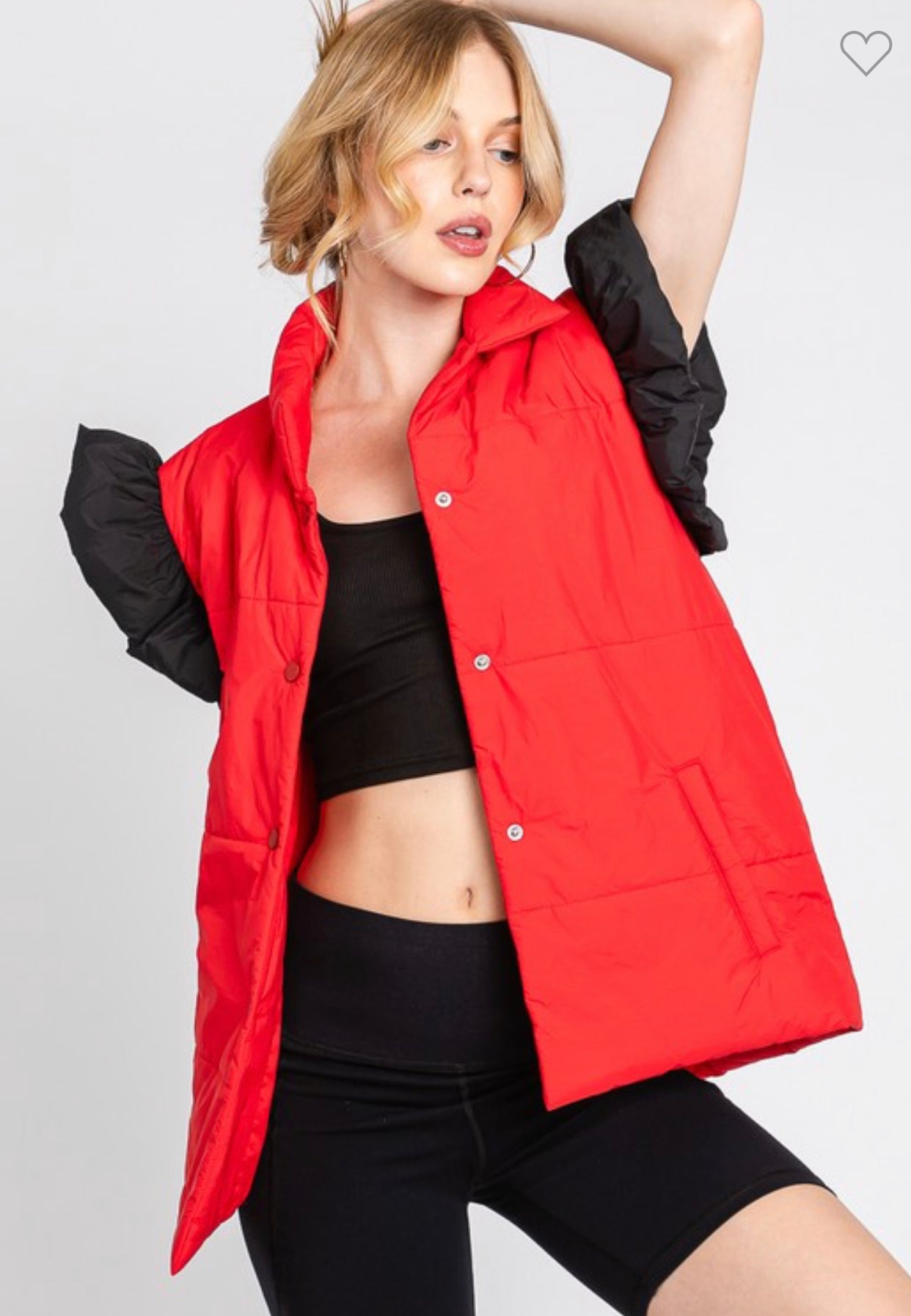 red puffer vest with black ruffle sleeves