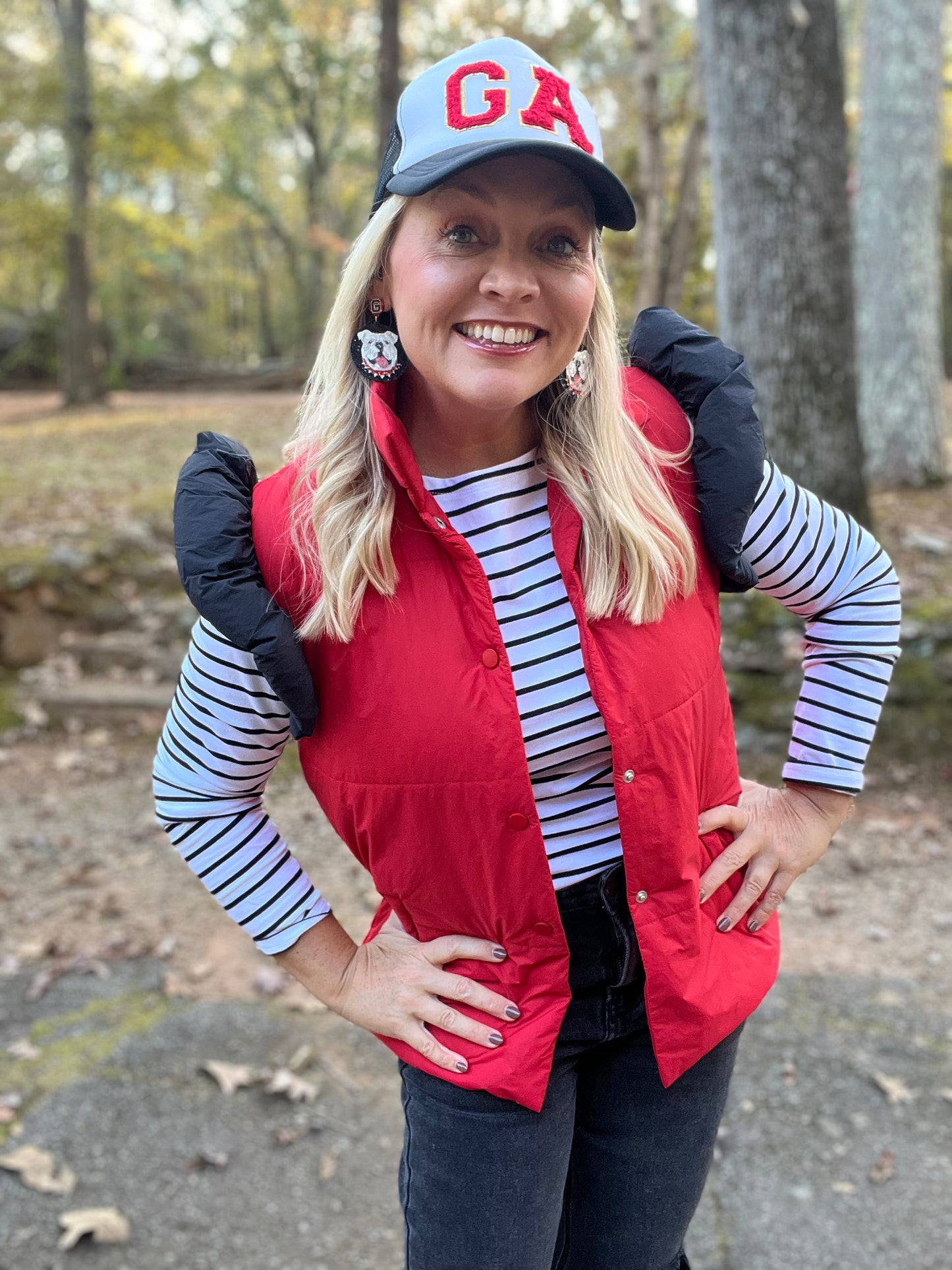 red puffer vest with black ruffle sleeves