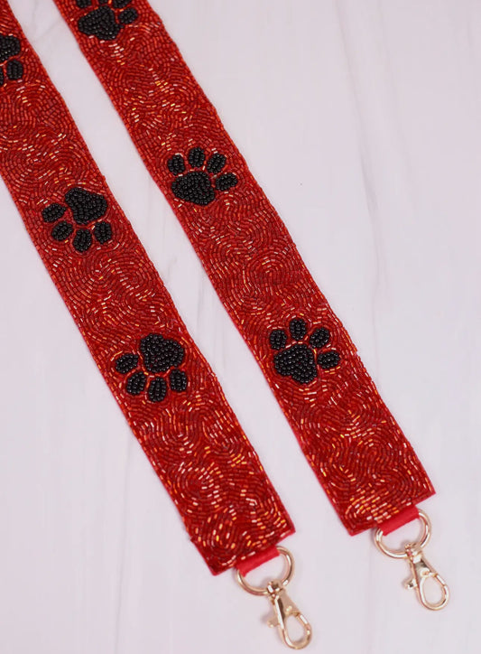 Beaded red strap black paw print