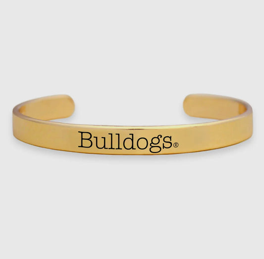 Gold metal cuff dogs