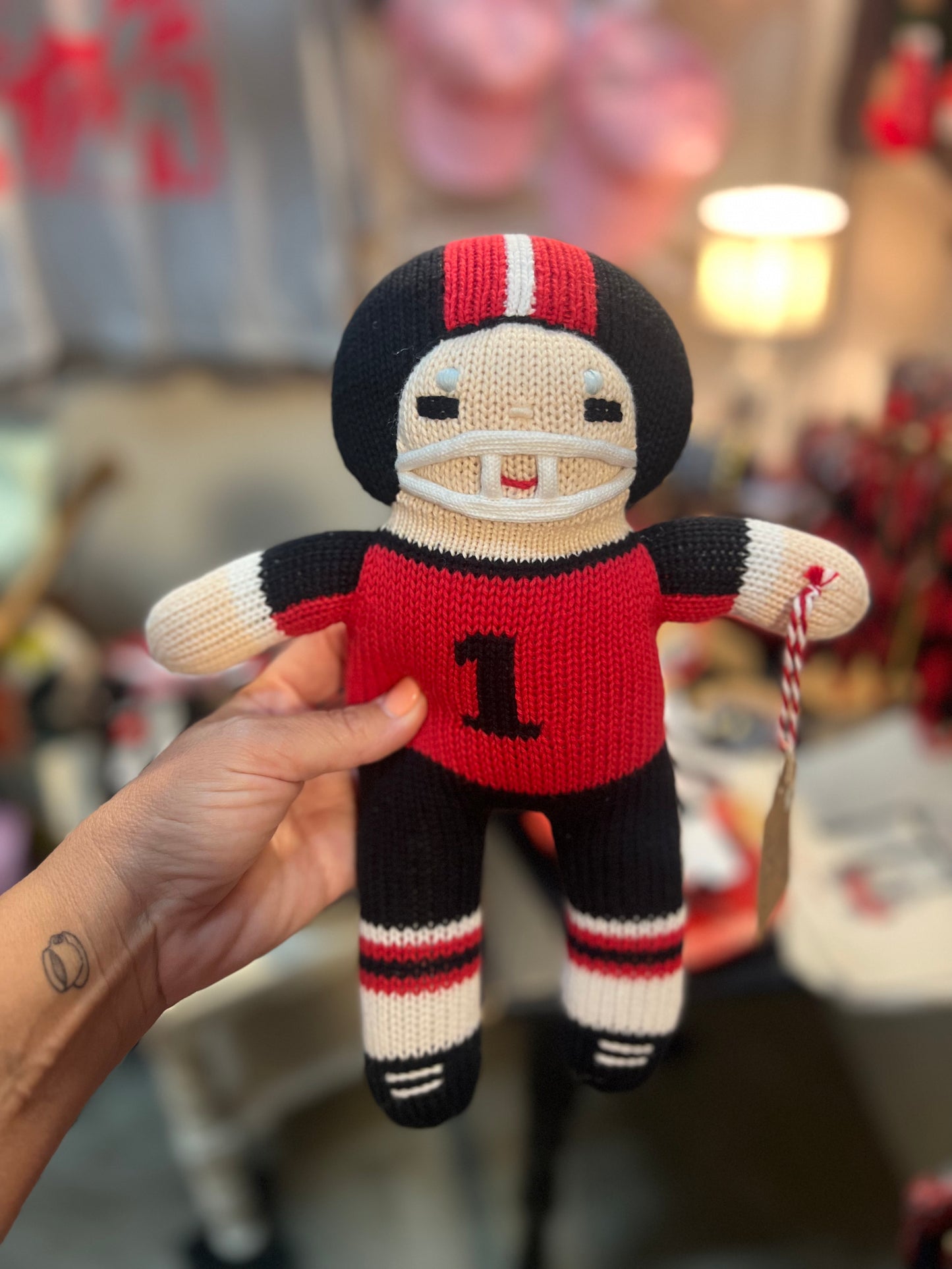 Handmade knit doll football player