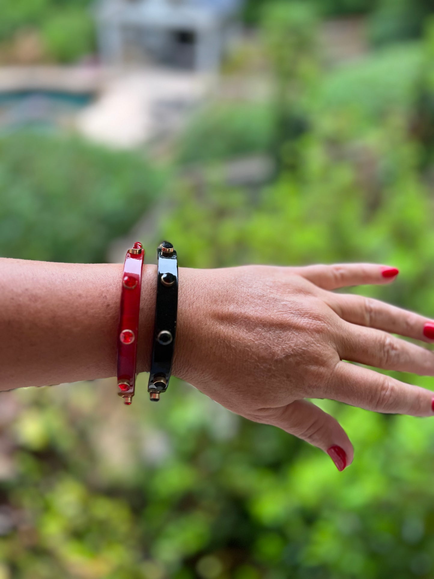 Red resin bracelet with rhinestone studs